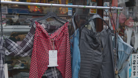 Close-Up-Of-Clothes-Hanging-Outside-Shops-On-Camden-High-Street-In-North-London-UK-2